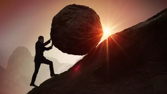 man boulder uphill